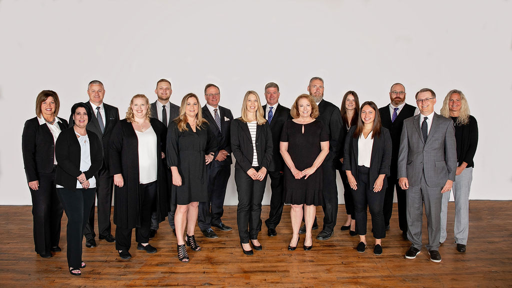 Legacy Financial group photo in front of a white wall