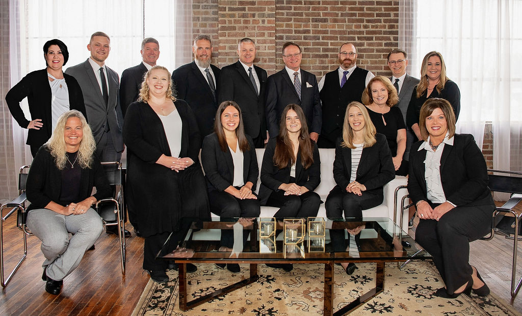 Legacy Financial group photo in a living room setting